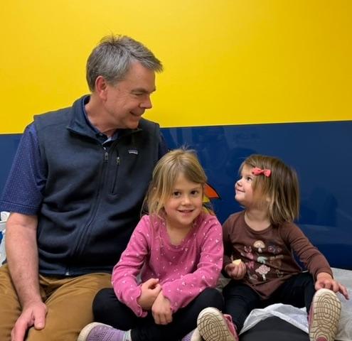 photo of  a pediatrician with kids